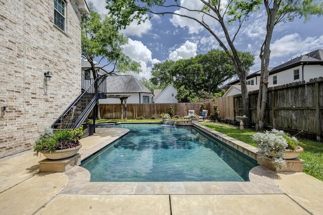 view of pool with a fenced in pool, stairs, and a fenced backyard