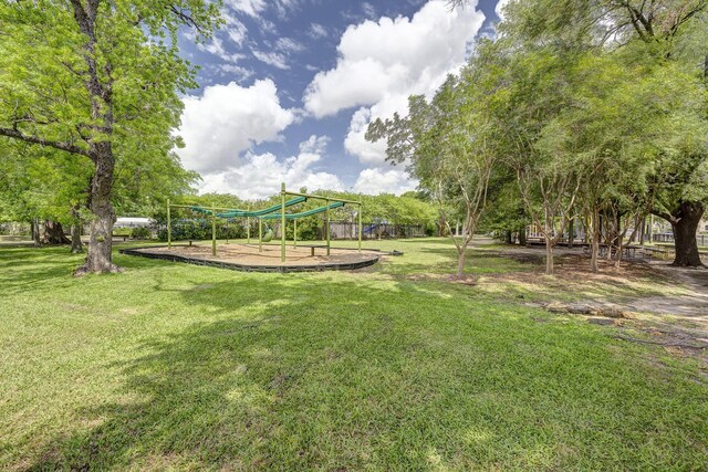 surrounding community featuring a lawn and playground community