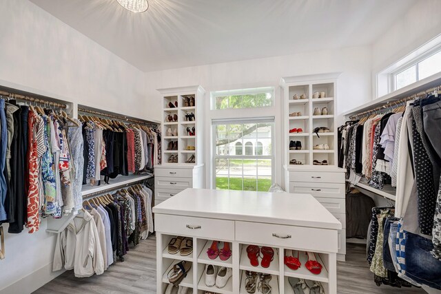 walk in closet featuring light wood finished floors