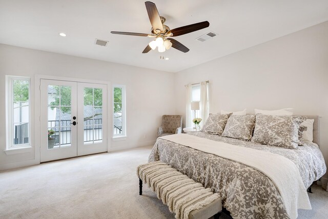 carpeted bedroom with access to outside, ceiling fan, visible vents, and french doors