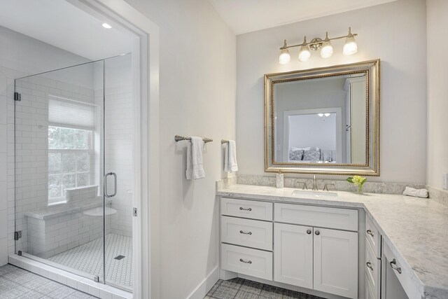 bathroom with vanity and a shower stall