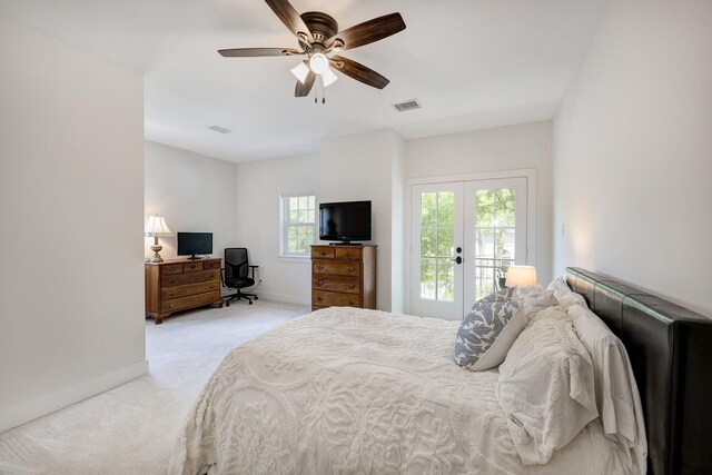 carpeted bedroom with ceiling fan, french doors, access to exterior, visible vents, and baseboards