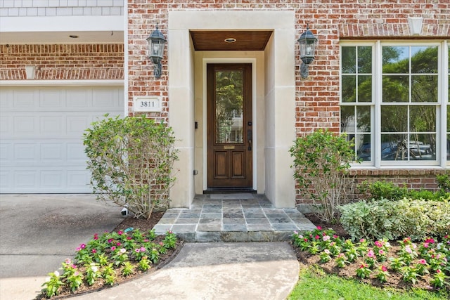 doorway to property with brick siding