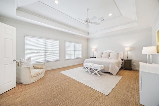bedroom with crown molding, light carpet, baseboards, recessed lighting, and a tray ceiling