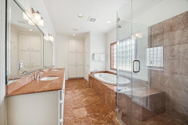 full bath featuring a sink, double vanity, marble finish floor, a bath, and a stall shower