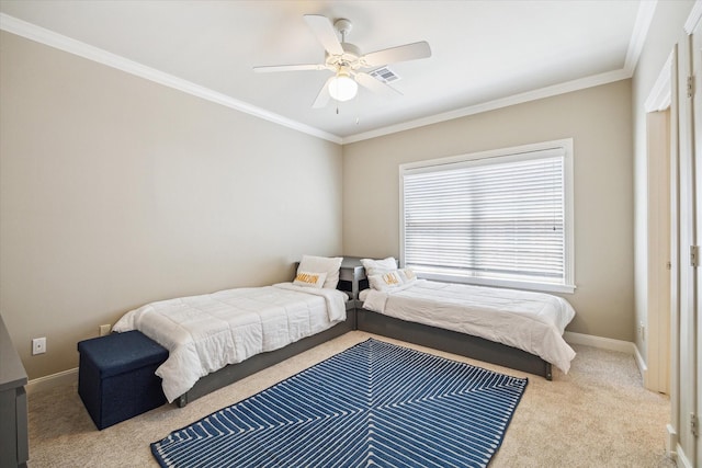 bedroom with crown molding, carpet floors, baseboards, and ceiling fan