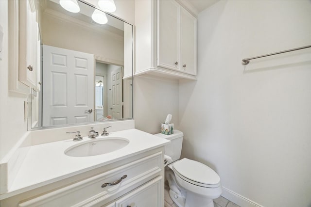 half bath featuring vanity, tile patterned floors, and toilet