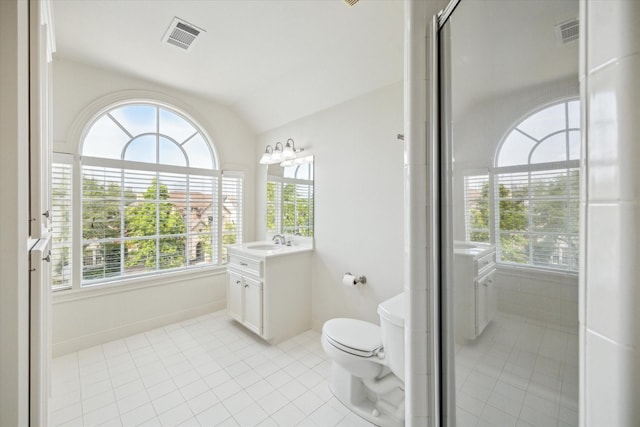 full bath with tile patterned floors, vaulted ceiling, a wealth of natural light, and visible vents