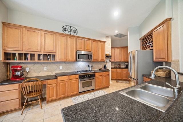 kitchen featuring light tile patterned flooring, open shelves, appliances with stainless steel finishes, a sink, and backsplash
