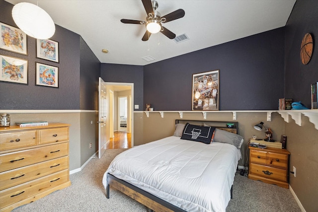bedroom with carpet floors, baseboards, and visible vents