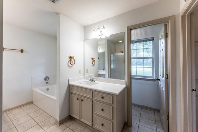 bathroom featuring baseboards, a shower stall, tile patterned flooring, and vanity
