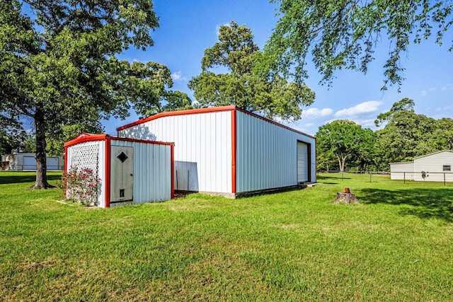 view of outbuilding featuring fence and an outdoor structure
