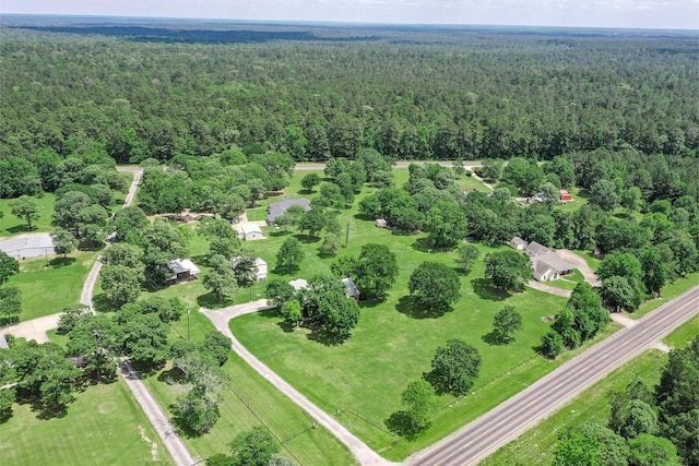 birds eye view of property with a wooded view