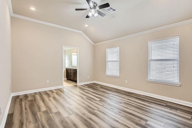 1946 Mayweather Ln, Richmond, TX 77406 - spare room with crown molding, vaulted ceiling, a ceiling fan, light wood-style floors, and recessed lighting