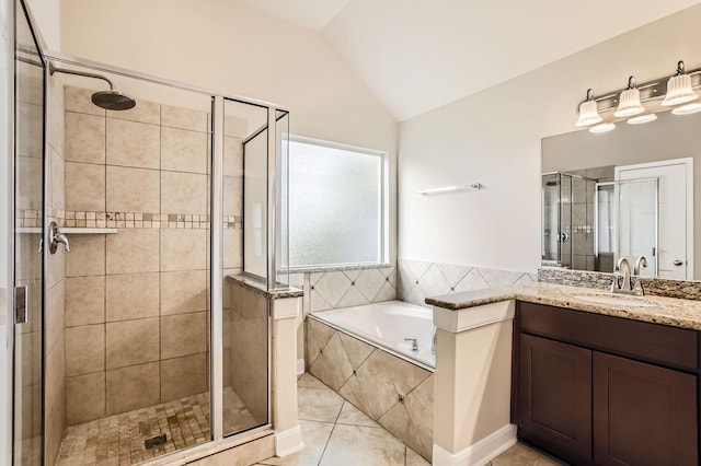 bathroom with a garden tub, a shower stall, vanity, tile patterned floors, and lofted ceiling