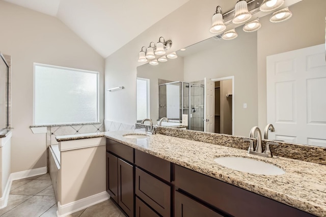 full bathroom with lofted ceiling, a sink, tile patterned flooring, and a stall shower