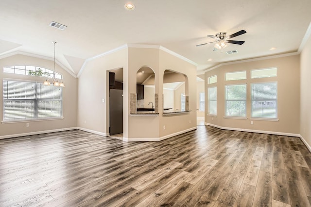 unfurnished living room with dark wood finished floors, lofted ceiling, and visible vents