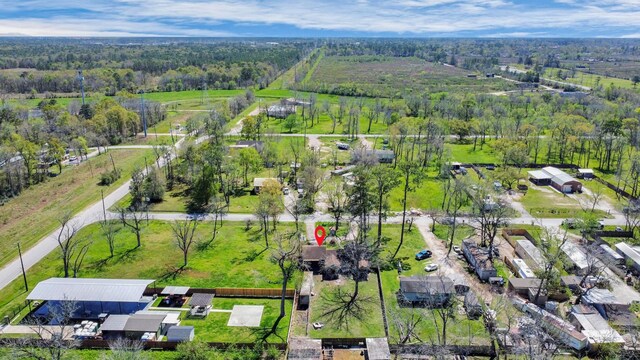 birds eye view of property with a wooded view