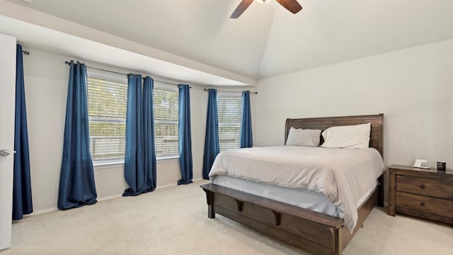 carpeted bedroom featuring ceiling fan, baseboards, and lofted ceiling
