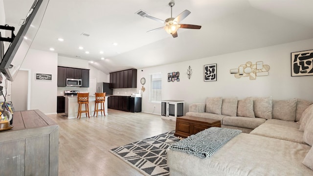 living area with ceiling fan, light wood-style flooring, recessed lighting, lofted ceiling, and visible vents