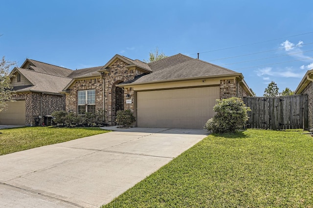 ranch-style home with fence, a front lawn, brick siding, a garage, and driveway