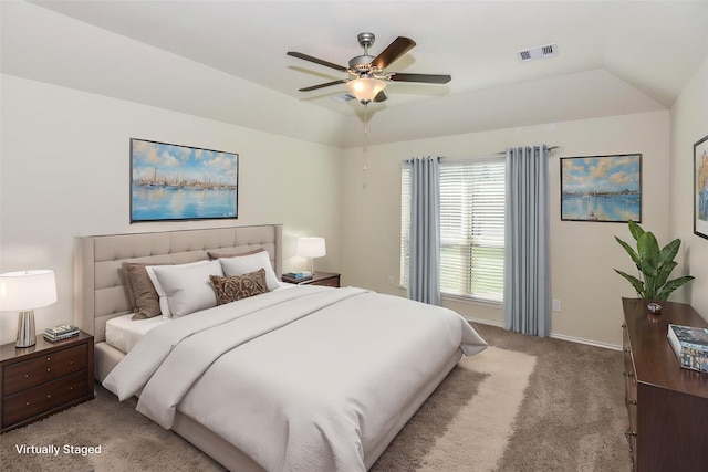 bedroom featuring ceiling fan, carpet floors, baseboards, lofted ceiling, and visible vents