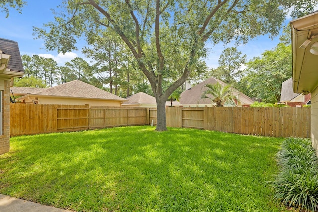 view of yard with a fenced backyard