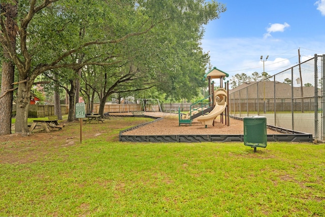 view of play area featuring a yard and fence