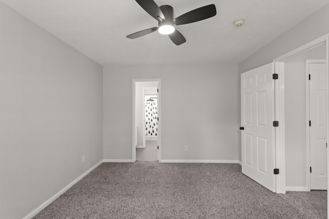 unfurnished bedroom featuring carpet flooring, a ceiling fan, and baseboards