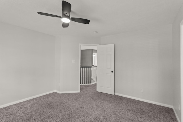 unfurnished bedroom featuring baseboards, carpet flooring, and ceiling fan