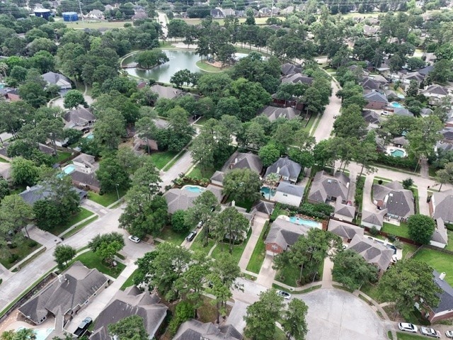 drone / aerial view with a residential view and a water view