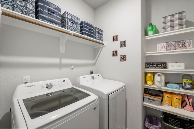 11310 Cora Ln, Willis, TX 77318 - clothes washing area with independent washer and dryer and laundry area