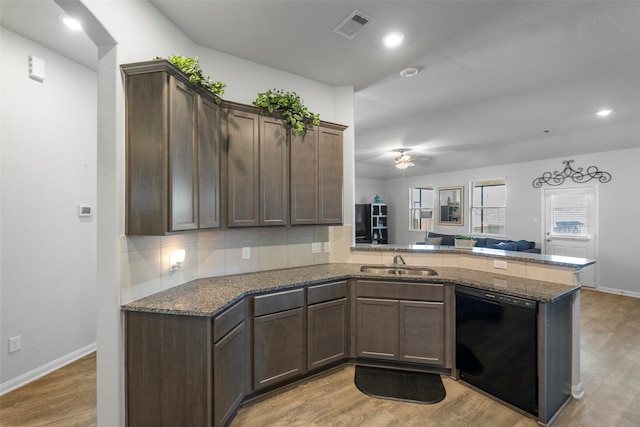 11310 Cora Ln, Willis, TX 77318 - kitchen with a peninsula, light wood-style floors, ceiling fan, a sink, and dishwasher