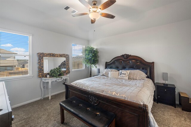 11310 Cora Ln, Willis, TX 77318 - bedroom featuring baseboards, visible vents, ceiling fan, and carpet