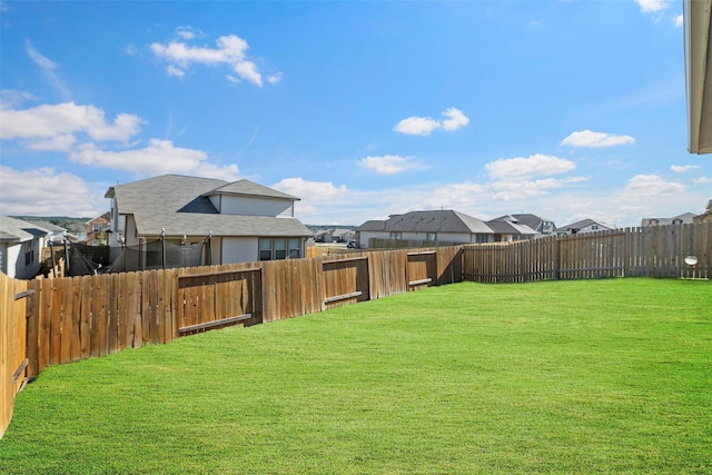 11310 Cora Ln, Willis, TX 77318 - view of yard featuring a residential view and a fenced backyard