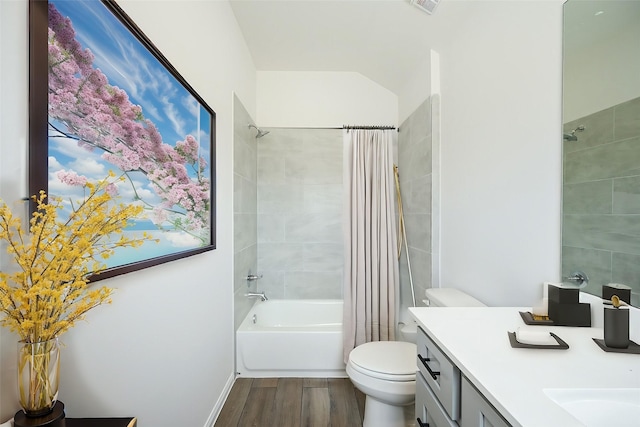 14238 Elkwood Pine Dr, Houston, TX 77032 - full bathroom featuring visible vents, wood finished floors, shower / tub combo, vanity, and toilet
