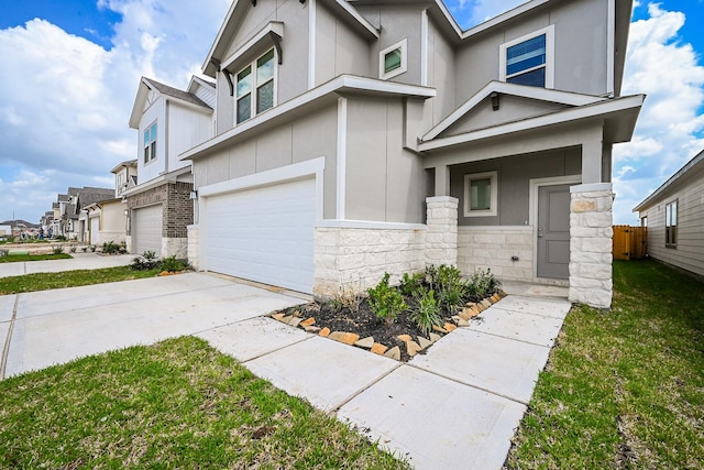 14515 Aston Pine Dr, Houston, TX 77032 - view of front of property with an attached garage, a residential view, stone siding, and concrete driveway