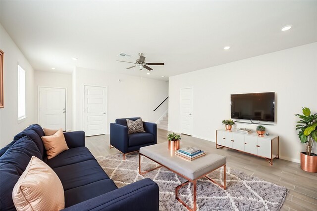 14515 Aston Pine Dr, Houston, TX 77032 - living room featuring light wood-type flooring, recessed lighting, stairs, and ceiling fan