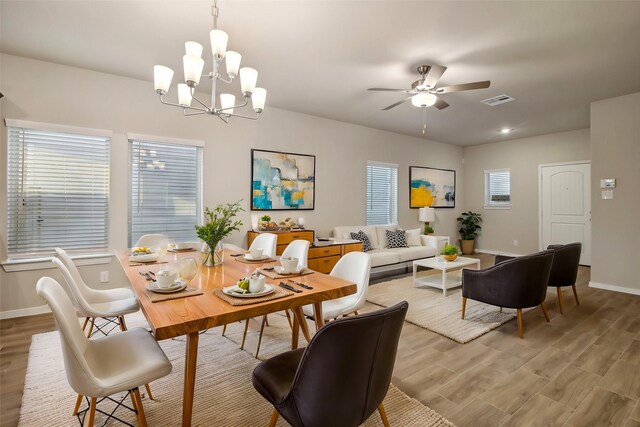 14515 Aston Pine Dr, Houston, TX 77032 - dining area with visible vents, light wood finished floors, and baseboards