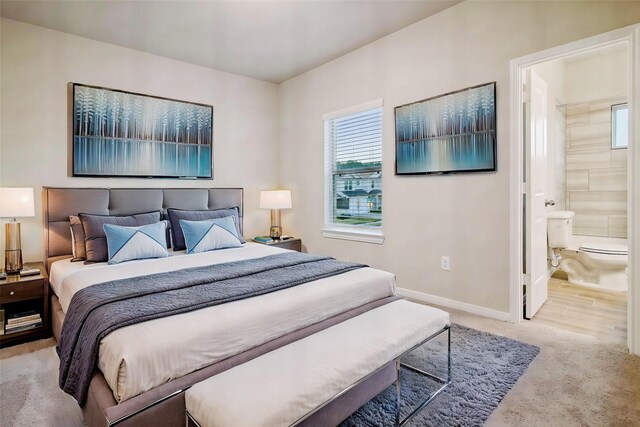 14515 Aston Pine Dr, Houston, TX 77032 - bedroom with baseboards, carpet flooring, and connected bathroom