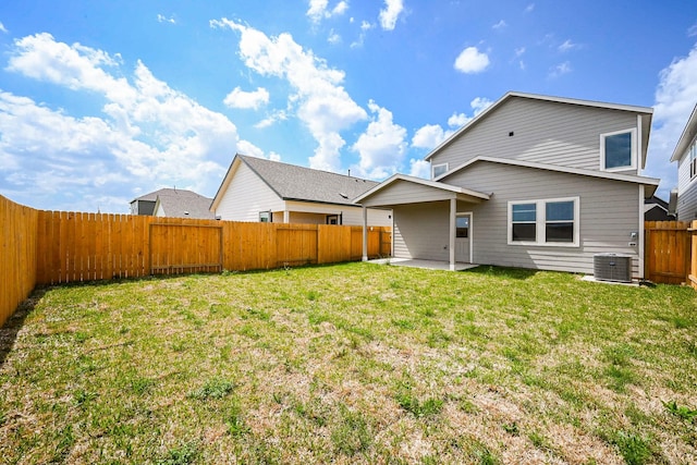 14515 Aston Pine Dr, Houston, TX 77032 - back of property featuring a patio, a fenced backyard, a lawn, and cooling unit