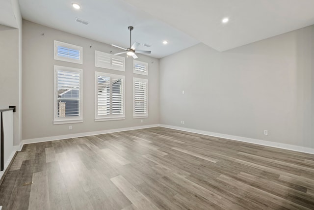 1220 Sloane Manor Trce, Houston, TX 77043 - spare room featuring a ceiling fan, wood finished floors, and a wealth of natural light