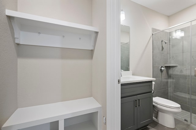 1220 Sloane Manor Trce, Houston, TX 77043 - bathroom with vanity, tile patterned flooring, a stall shower, and toilet