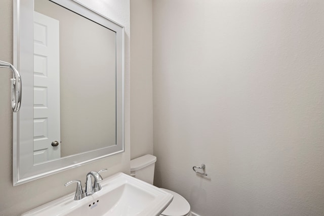 1220 Sloane Manor Trce, Houston, TX 77043 - half bathroom with a sink and toilet