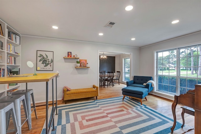 sitting room featuring recessed lighting, ornamental molding, wood finished floors, and visible vents