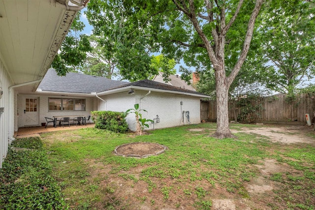view of yard with a patio and fence