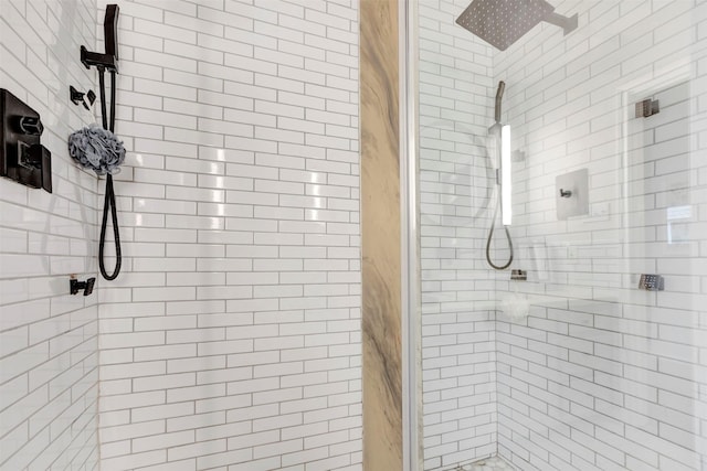 bathroom featuring a shower stall