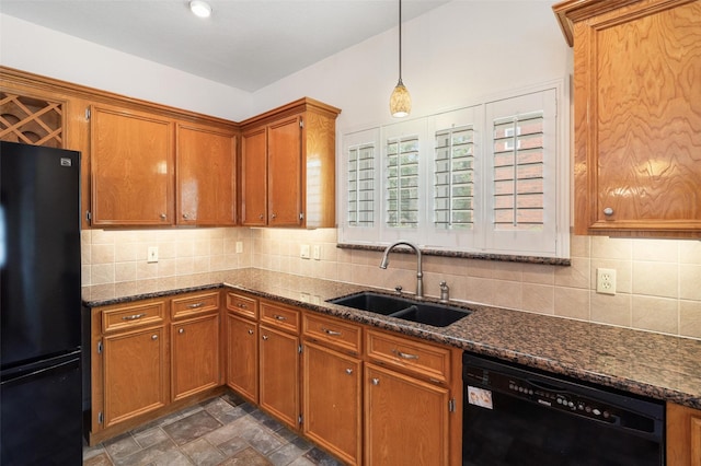 124 Lake Point Dr, League City, TX 77573 - kitchen featuring brown cabinetry, a sink, black appliances, and tasteful backsplash