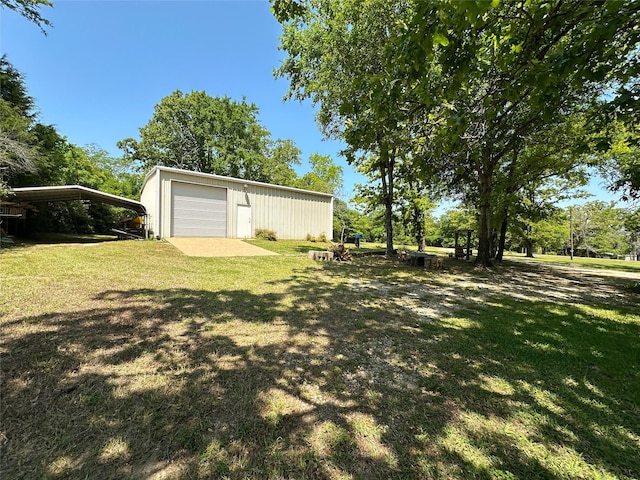 5325 County Road 2691, Buffalo, TX 75831 - view of yard with an outdoor structure and a detached garage