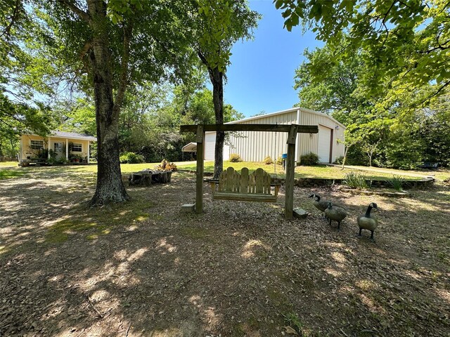 5325 County Road 2691, Buffalo, TX 75831 - view of yard featuring a garage and an outdoor structure